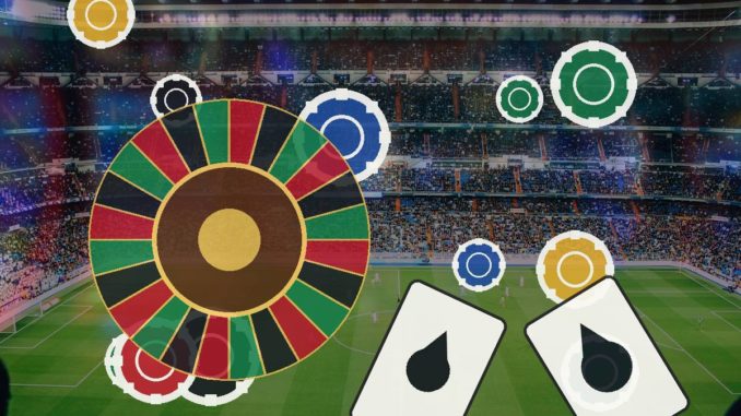 Colorful roulette wheel and poker chips over a soccer stadium, with two playing cards in the foreground.